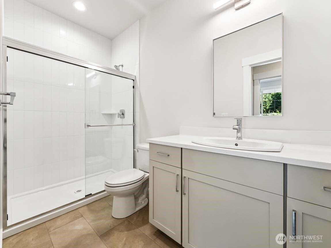 25012 181st Avenue Southeast, Unit 5 Covington, WA 98042 - Photo 16 of 34 a bathroom with a sink toilet and shower