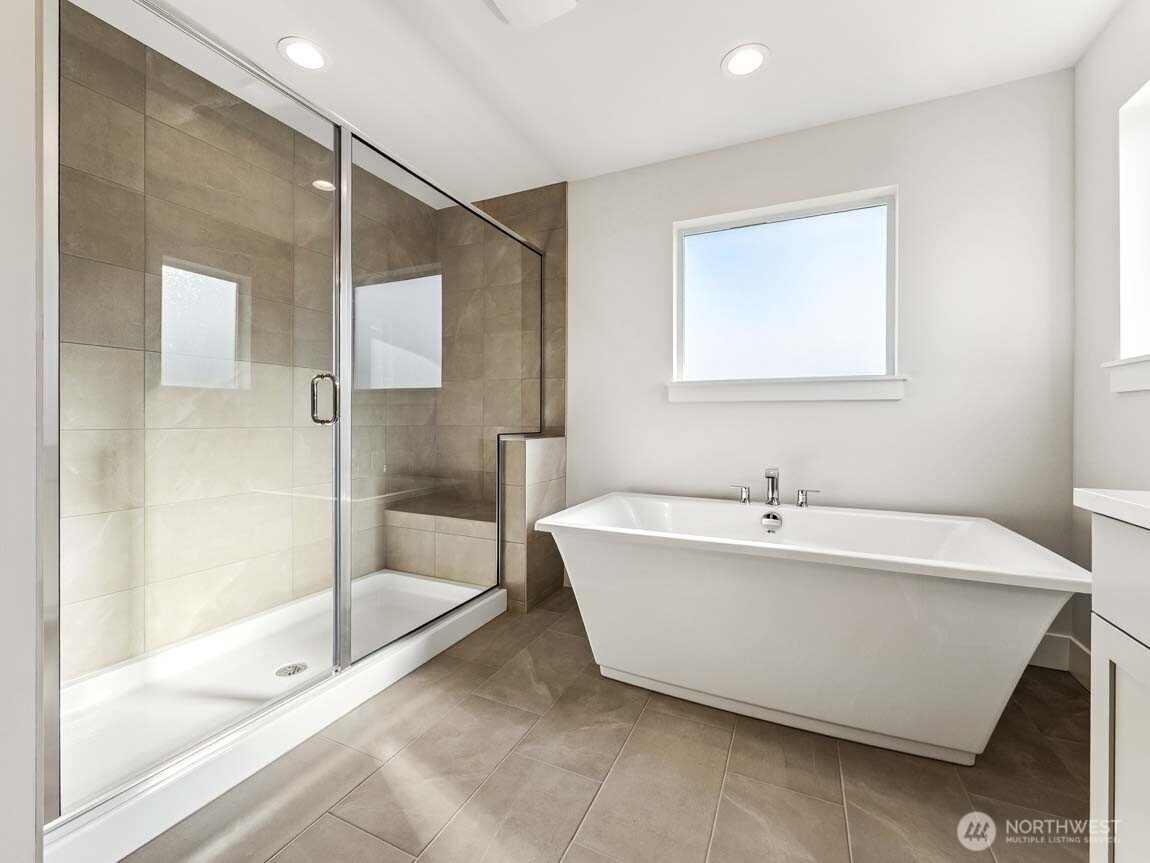 25012 181st Avenue Southeast, Unit 5 Covington, WA 98042 - Photo 20 of 34 a bathroom with a bathtub and shower