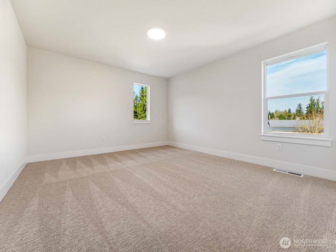 25012 181st Avenue Southeast, Unit 5 Covington, WA 98042 - Photo 24 of 34 an empty room with windows