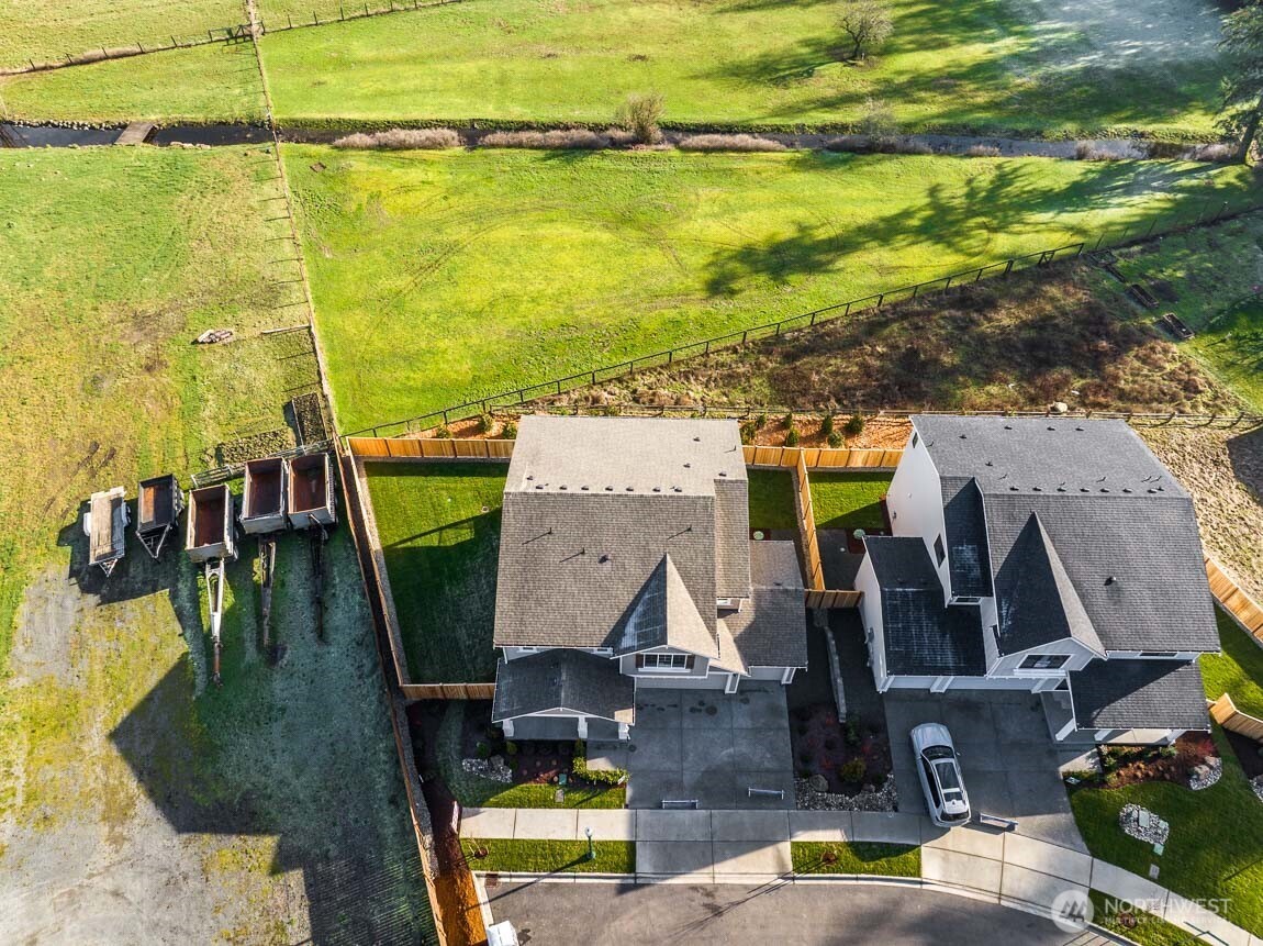 25012 181st Avenue Southeast, Unit 5 Covington, WA 98042 - Photo 27 of 34 an aerial view of houses with outdoor space