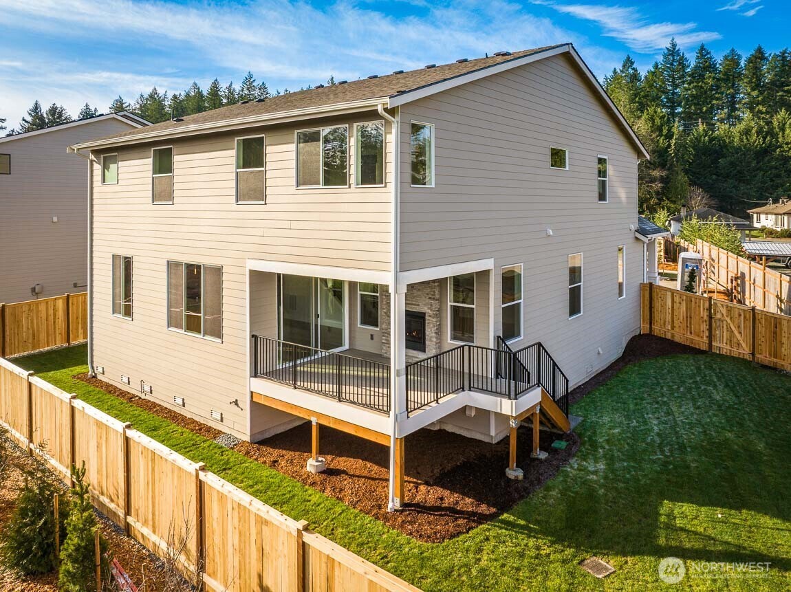 25012 181st Avenue Southeast, Unit 5 Covington, WA 98042 - Photo 29 of 34 aerial view of a house with a yard and sitting area