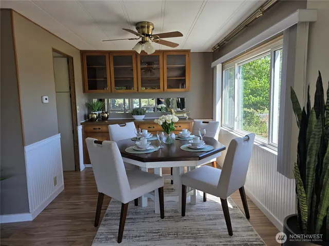 a view of a dining room with furniture window and wooden floor