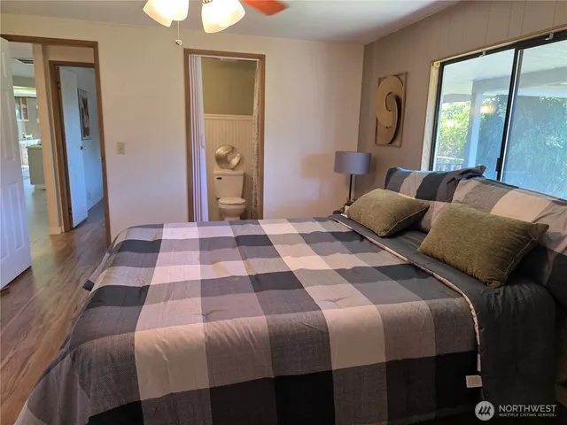 a white toilet sitting next to a shower curtain