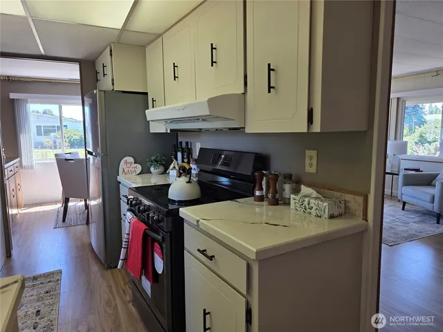 a kitchen with a table chairs and a stove
