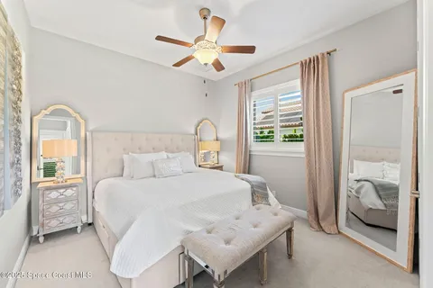 a bedroom with a large bed and a window