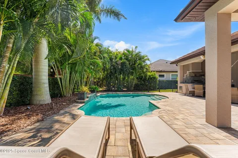 a view of backyard with a patio