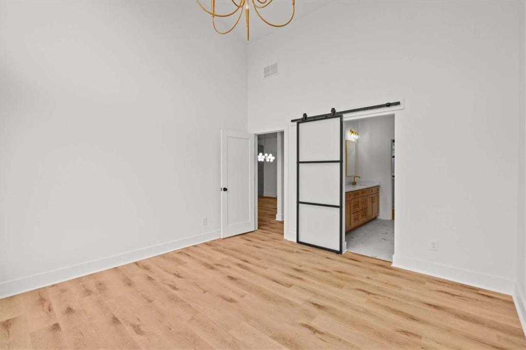 409 Lively Road Waco, GA 30182 - Photo 18 of 50 a view of a room with wooden floor and white walls