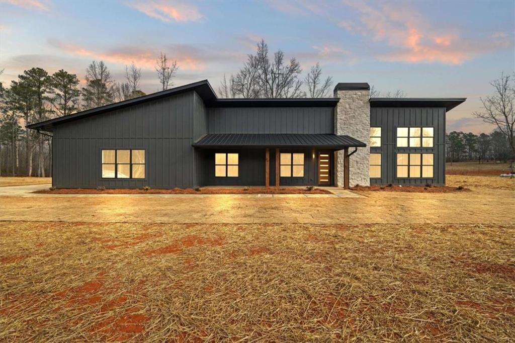 409 Lively Road Waco, GA 30182 - Photo 2 of 50 a front view of a house with a ocean view