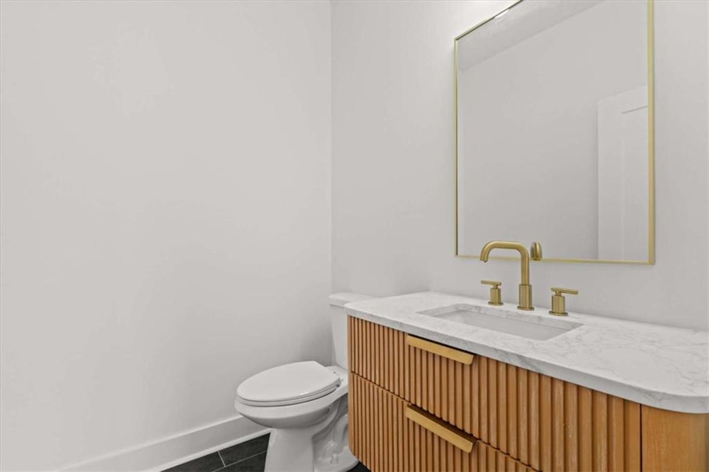 409 Lively Road Waco, GA 30182 - Photo 24 of 50 a bathroom with a sink and a toilet