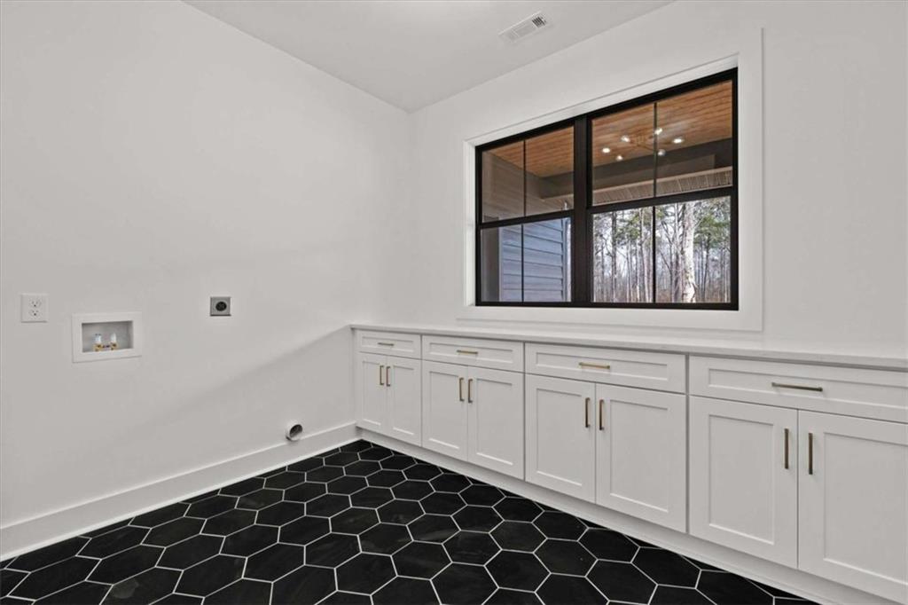 409 Lively Road Waco, GA 30182 - Photo 31 of 50 a view of a cabinet and window