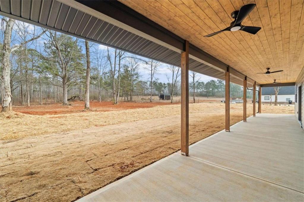 409 Lively Road Waco, GA 30182 - Photo 39 of 50 a view of an empty room with floor to ceiling windows