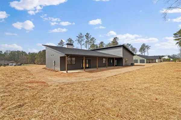 a house with trees in the background