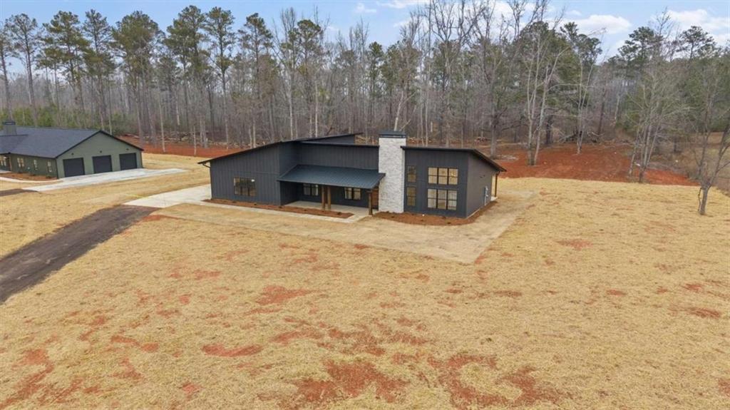 409 Lively Road Waco, GA 30182 - Photo 44 of 50 a view of a water fountain in the backyard of house