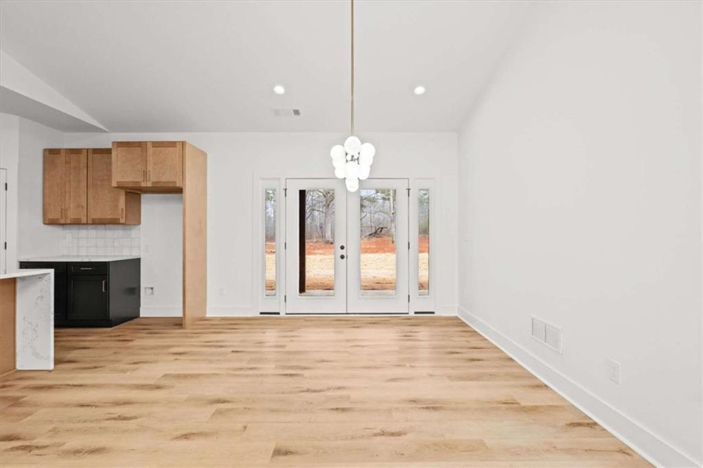 409 Lively Road Waco, GA 30182 - Photo 9 of 50 a view of a room with wooden floor and fireplace