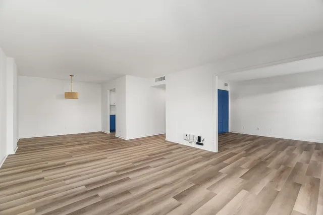 a view of a livingroom with wooden floor