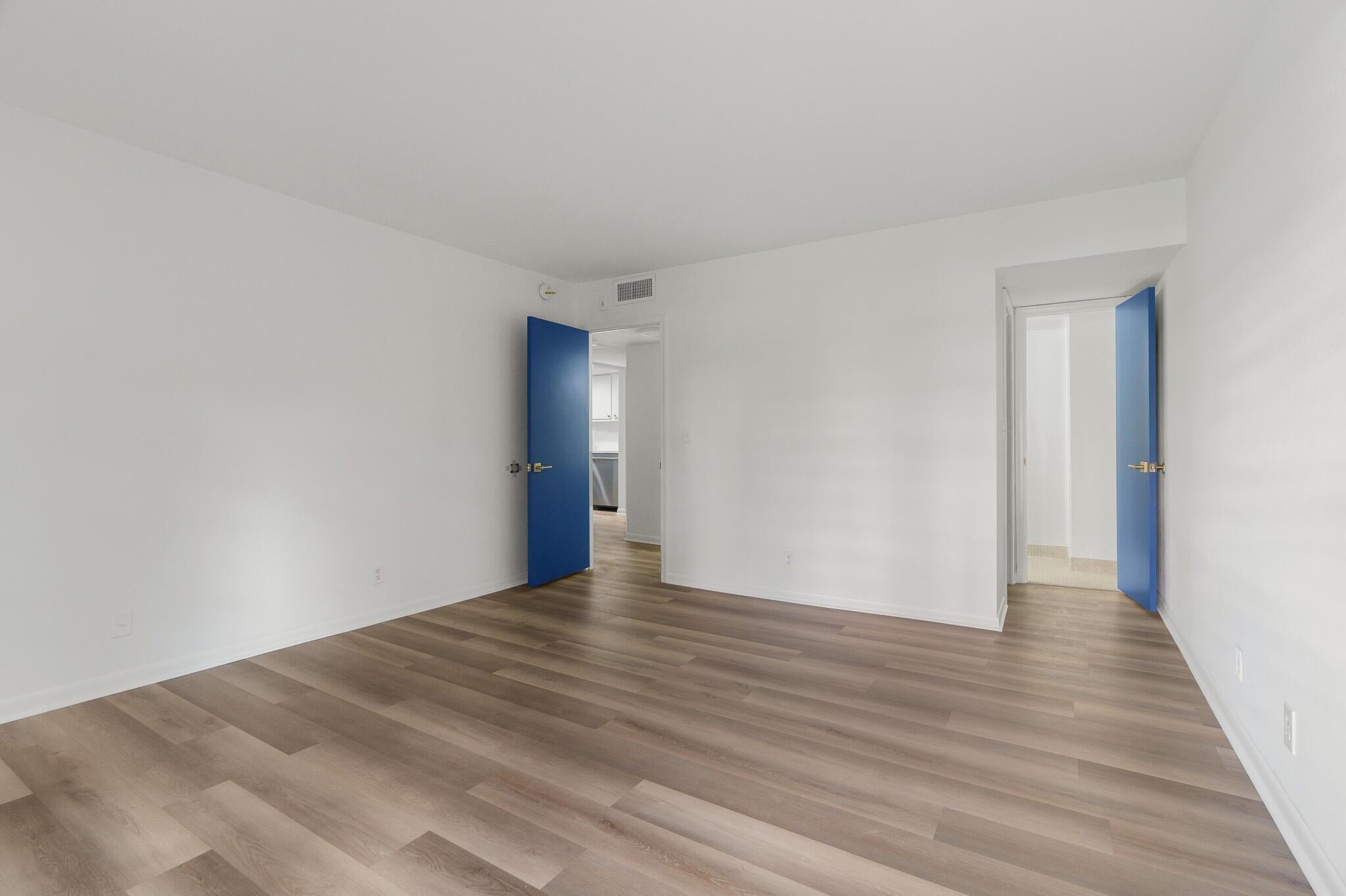 950 Ponce De Leon Road, Unit 208 Boca Raton, FL 33432 - Photo 15 of 43 a view of an empty room with wooden floor