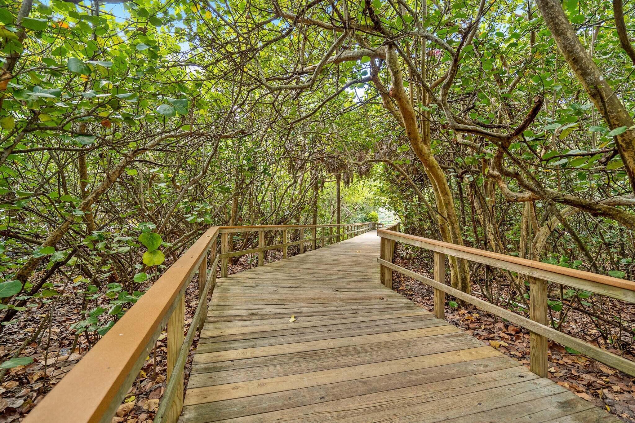 950 Ponce De Leon Road, Unit 208 Boca Raton, FL 33432 - Photo 39 of 43 a view of balcony with wooden floor and fence