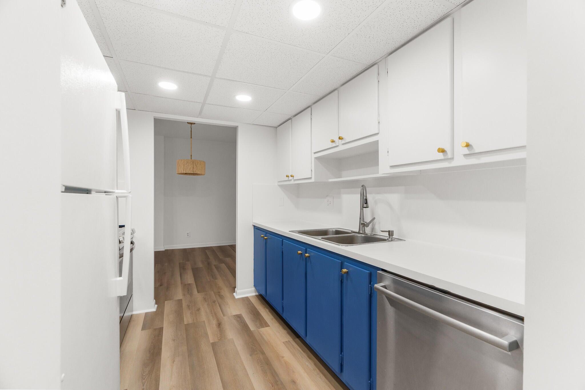 950 Ponce De Leon Road, Unit 208 Boca Raton, FL 33432 - Photo 6 of 43 a kitchen with a sink stainless steel appliances and cabinets