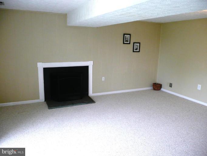 4713 East Joppa Road Nottingham, MD 21236 - Photo 12 of 24 a room with a fireplace