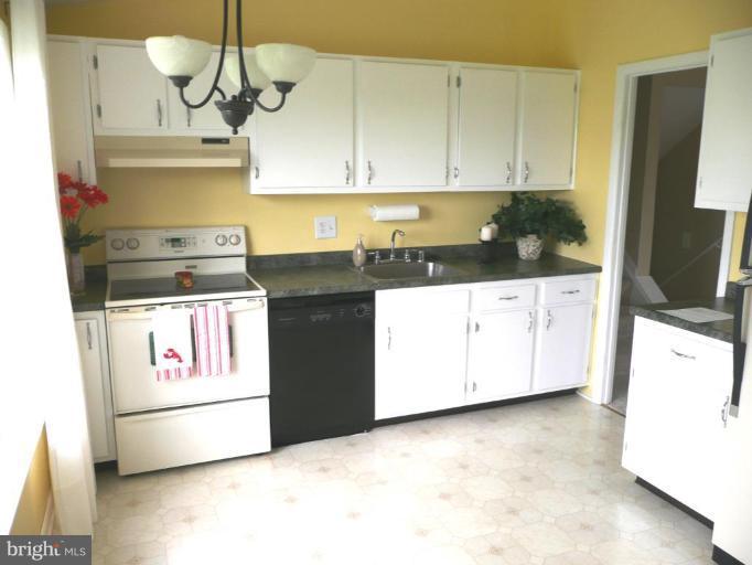 4713 East Joppa Road Nottingham, MD 21236 - Photo 14 of 24 a kitchen with a stove and a microwave