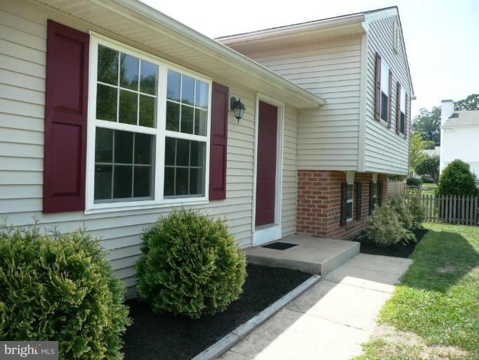 4713 East Joppa Road Nottingham, MD 21236 - Photo 9 of 24 a front view of a house with a garden