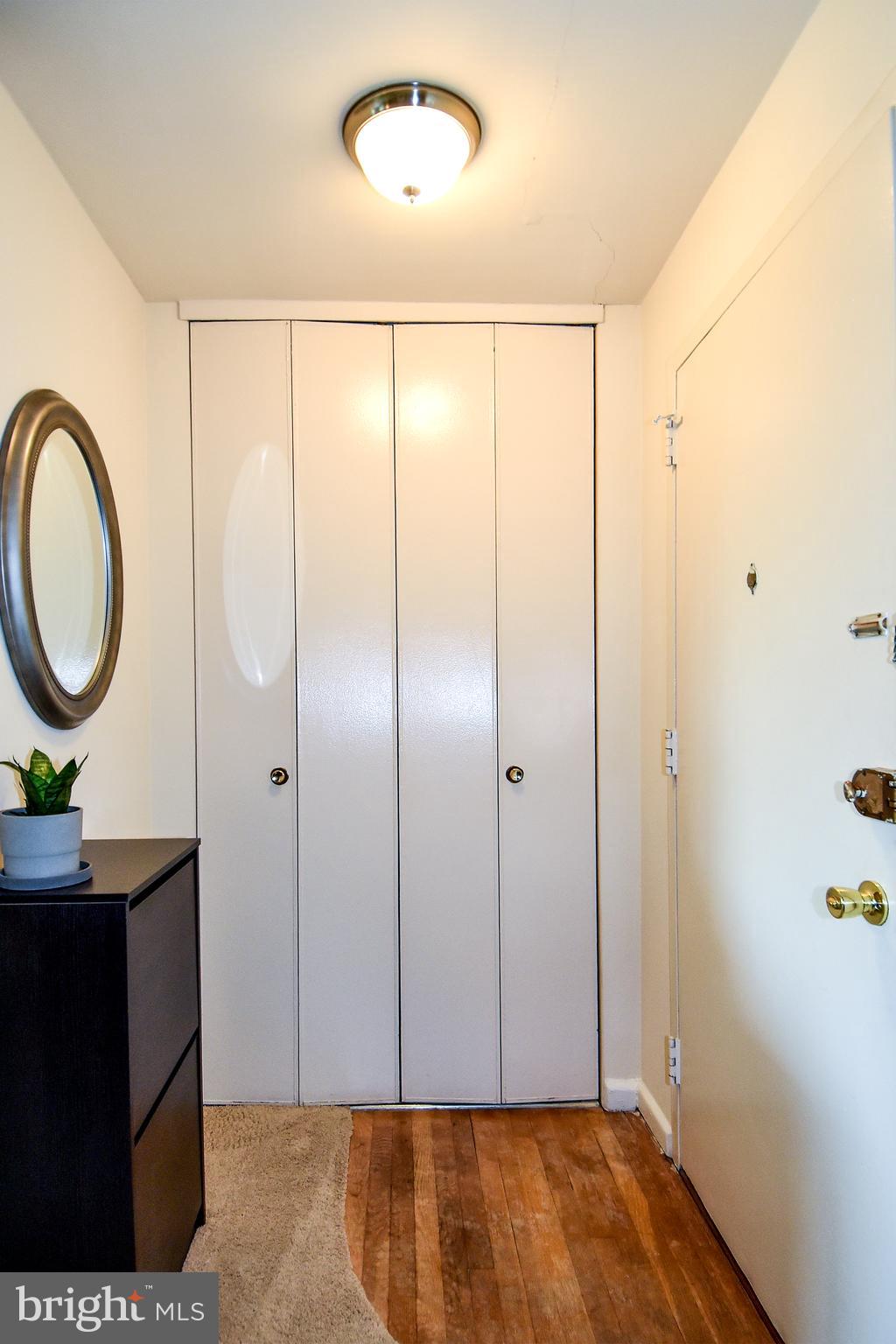 1200 South Arlington Ridge Road, Unit 510 Arlington, VA 22202 - Photo 6 of 32 a view of a room with wooden floor and white walls