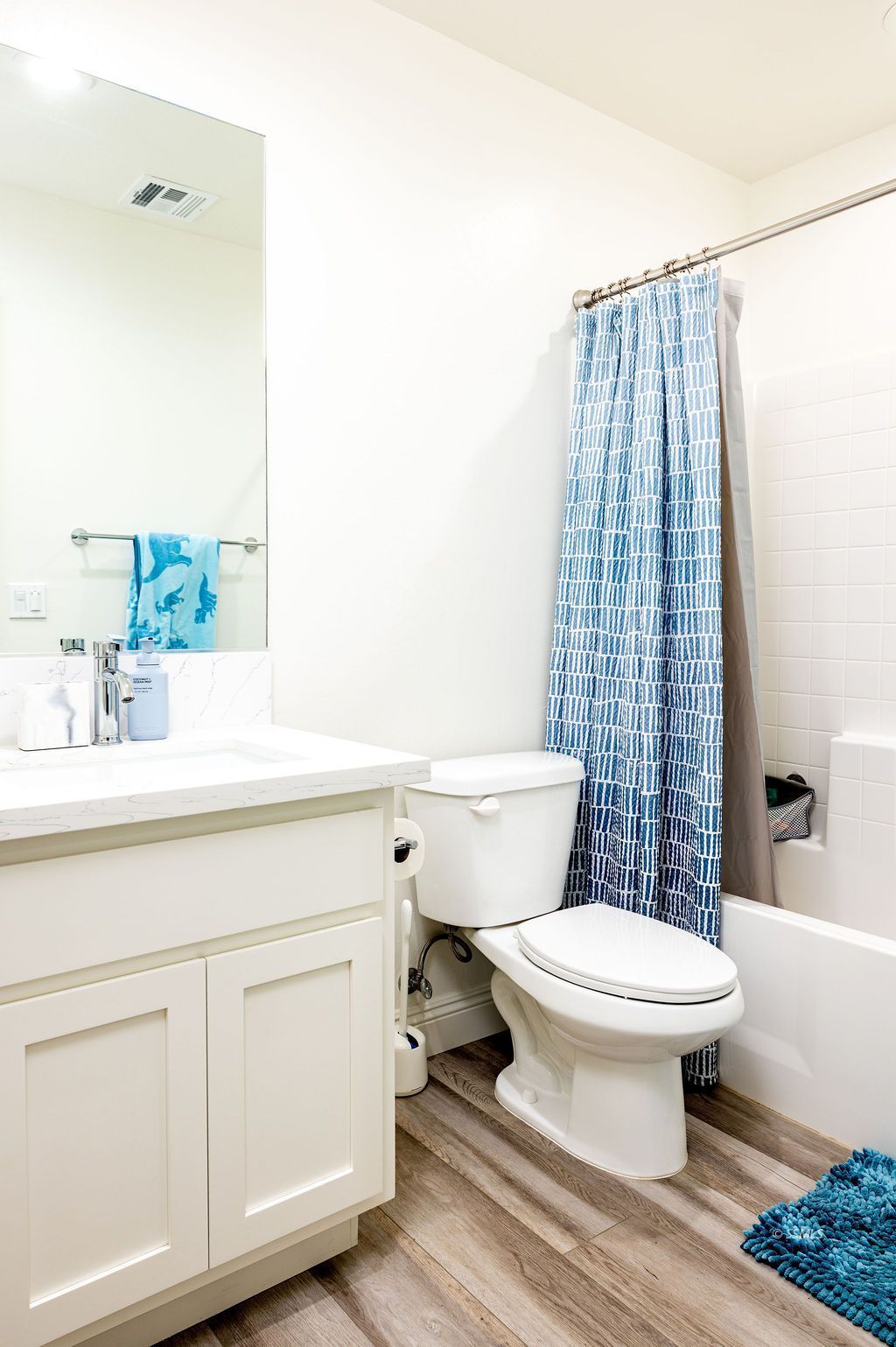 1229 South Ranger Street Ridgecrest, CA 93555 - Photo 19 of 36 a bathroom with a sink toilet and shower