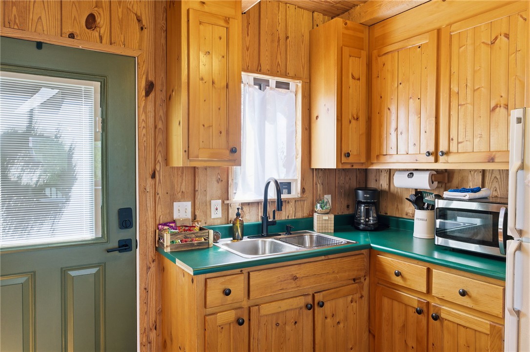 1 Kitty Hawk Lane Six Mile, SC 29682 - Photo 14 of 46 This cozy kitchen features abundant wood cabinetry and a functional layout, perfect for everyday meals.