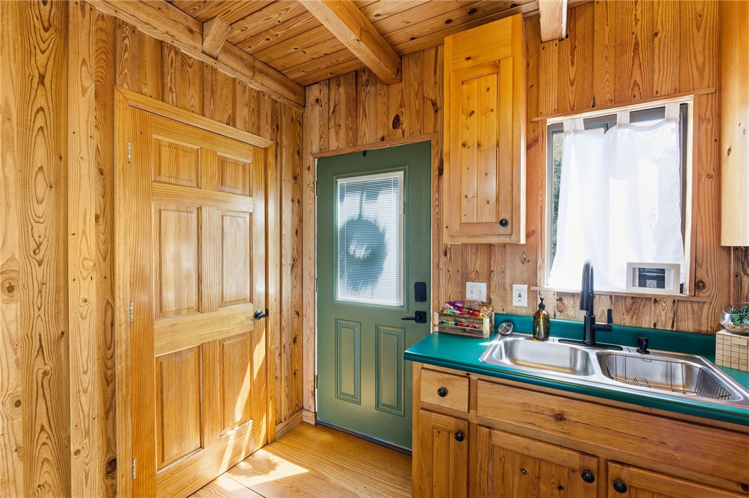 1 Kitty Hawk Lane Six Mile, SC 29682 - Photo 17 of 46 This cozy kitchen showcases natural wood finishes and efficient design.