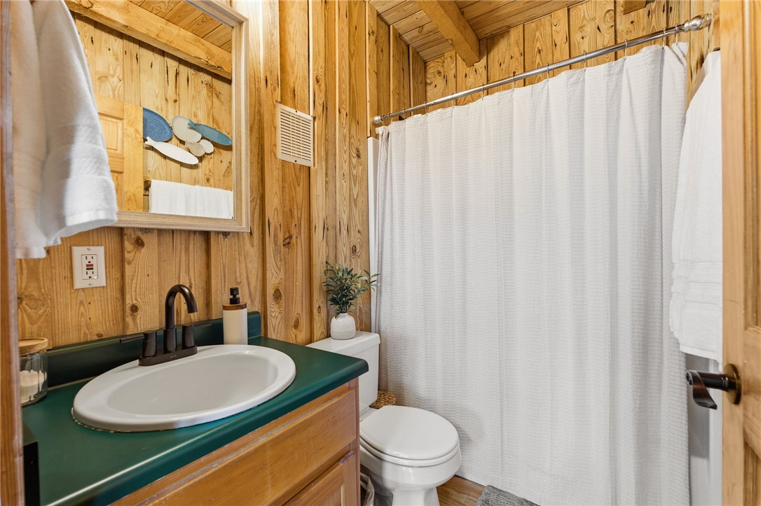1 Kitty Hawk Lane Six Mile, SC 29682 - Photo 20 of 46 This bathroom features wood paneling and a practical layout.