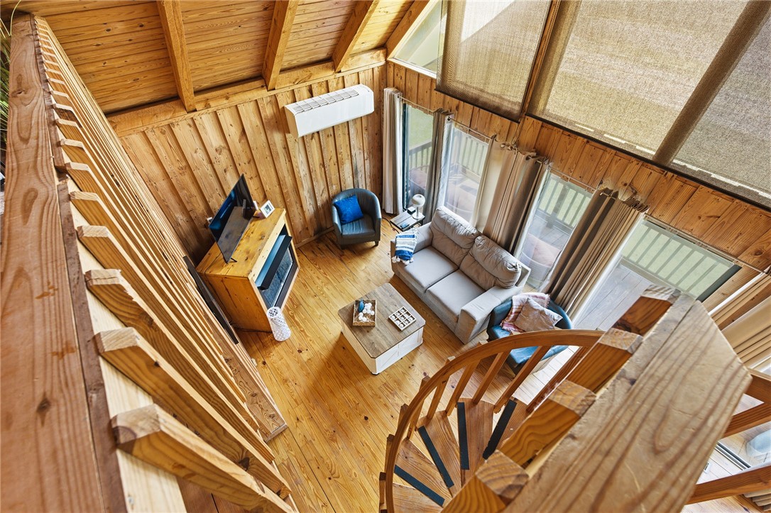 1 Kitty Hawk Lane Six Mile, SC 29682 - Photo 24 of 46 Warm wood tones define this inviting living area, featuring a charming spiral staircase.