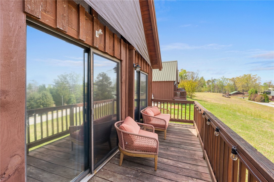 1 Kitty Hawk Lane Six Mile, SC 29682 - Photo 25 of 46 This outdoor deck offers ample space for relaxation and enjoyment of the natural surroundings.