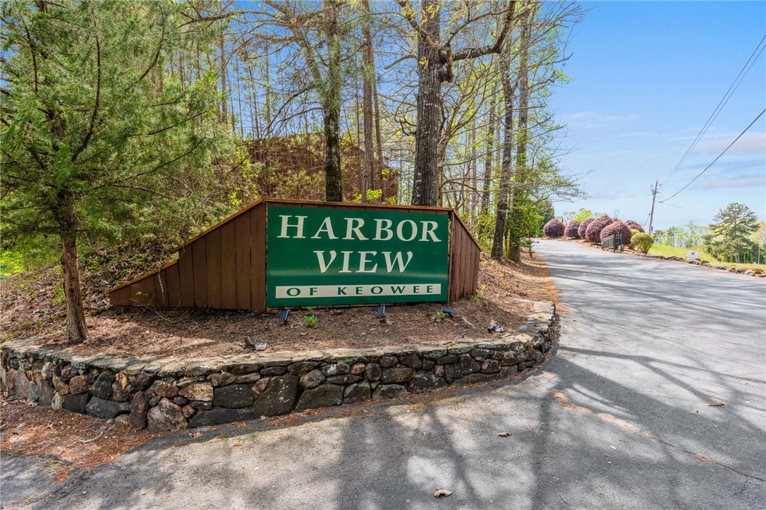 1 Kitty Hawk Lane Six Mile, SC 29682 - Photo 27 of 46 Welcome home to this inviting entrance, nestled among lush greenery, promising serene living.