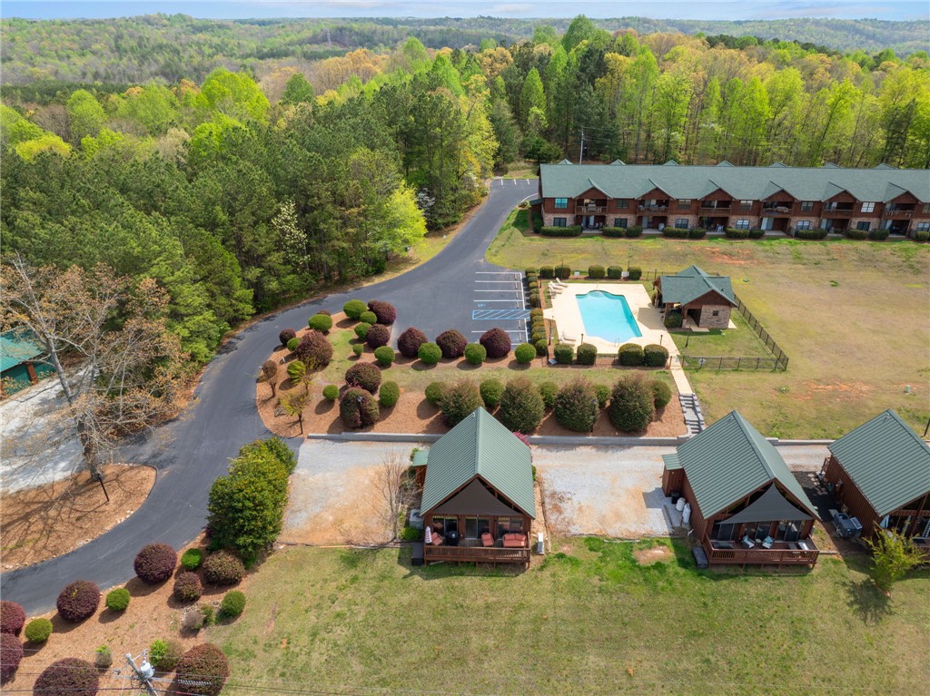 1 Kitty Hawk Lane Six Mile, SC 29682 - Photo 29 of 46 This scenic aerial view captures a vibrant community nestled among lush woodlands.