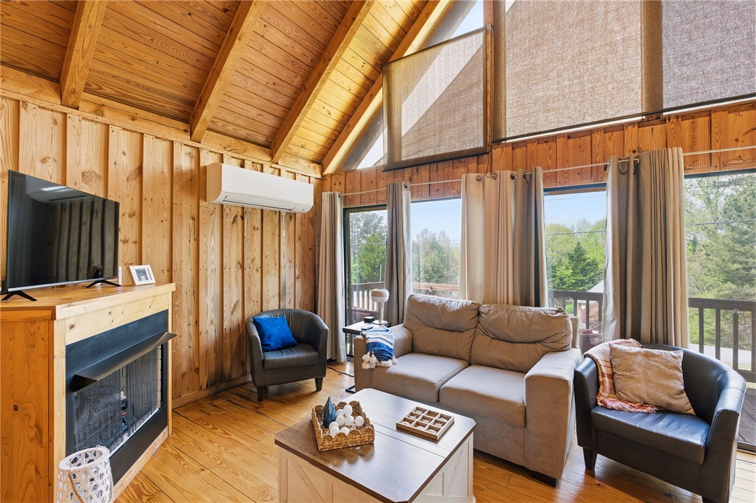 1 Kitty Hawk Lane Six Mile, SC 29682 - Photo 10 of 46 This inviting living area boasts rich wood accents and abundant natural light.