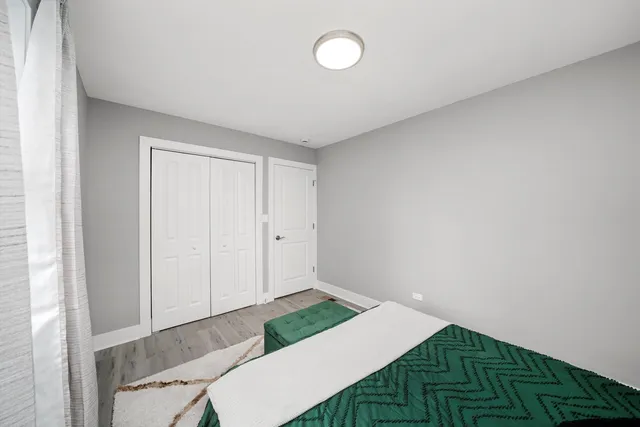 a room with a bed and a window