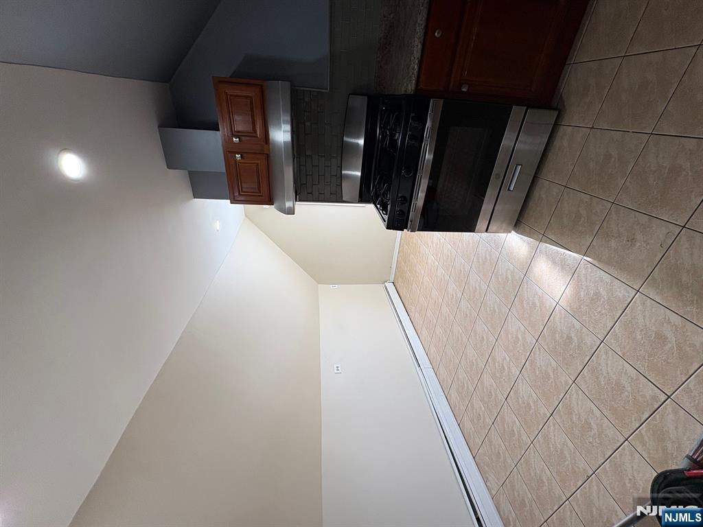 121 Rutgers Street, Unit 3 Belleville, NJ 07109 - Photo 3 of 11 a kitchen with a sink and a stove