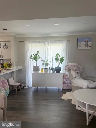 a living room with furniture and window