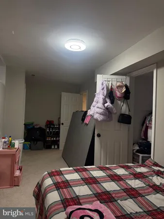 a bedroom with a bed and cabinets