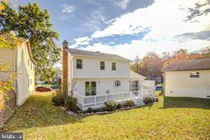 a view of house with backyard and garden