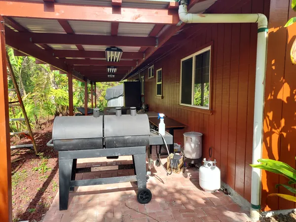 a view of a chairs and table in a patio