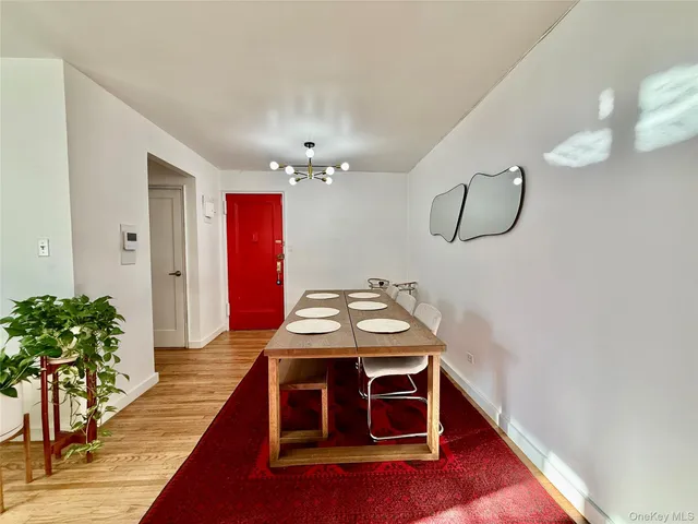 a view of a livingroom with furniture and wooden floor