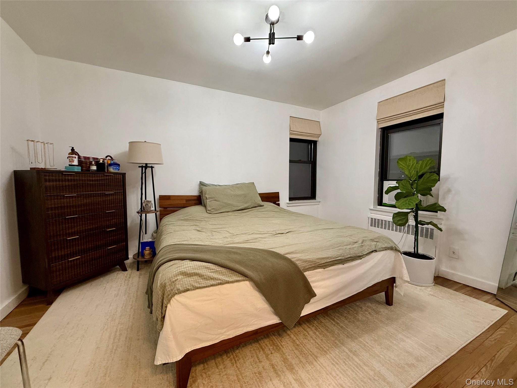 112-30 Northern Boulevard, Unit 2A Queens, NY 11368 - Photo 22 of 40 Bedroom with light wood finished floors