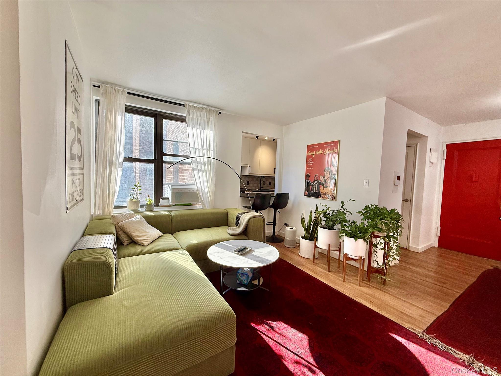 112-30 Northern Boulevard, Unit 2A Queens, NY 11368 - Photo 3 of 40 Living area featuring wood finished floors