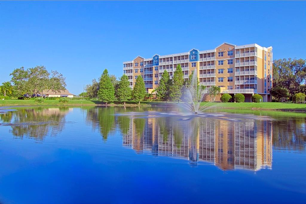 a view of a lake with a building in the background