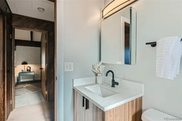 a bathroom with a sink and a mirror