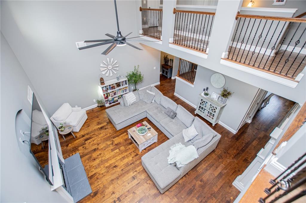 201 Overton Point Carrollton, GA 30116 - Photo 13 of 43 wooden floor with white walls and stairs