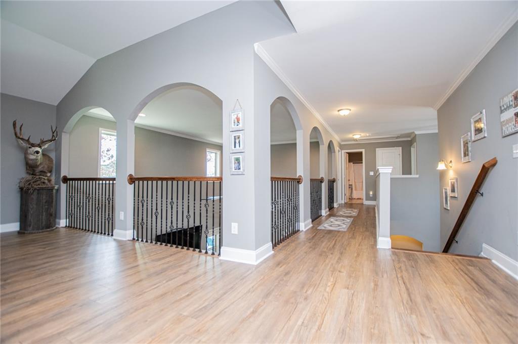 201 Overton Point Carrollton, GA 30116 - Photo 18 of 43 a view of a hallway view with wooden floor and staircase