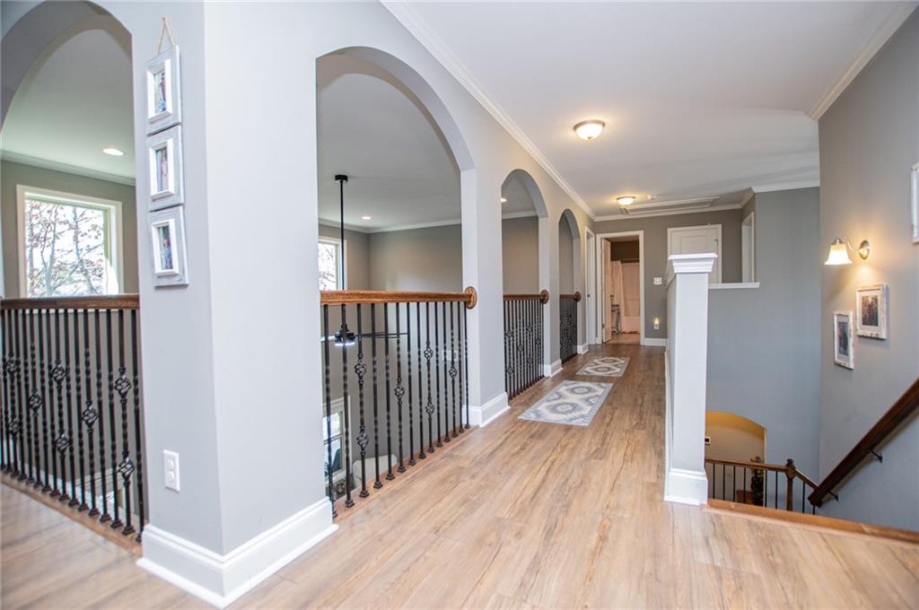 201 Overton Point Carrollton, GA 30116 - Photo 19 of 43 a view of a hallway view with wooden floor and staircase