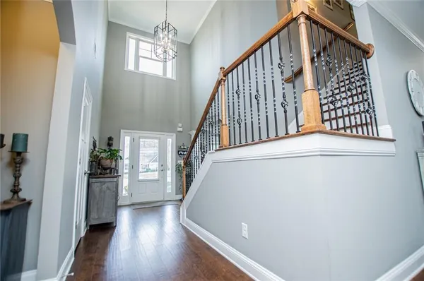 a view of a dining room with furniture entryway and wooden floor